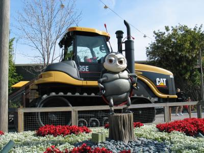 Francis posing in front of tractor
