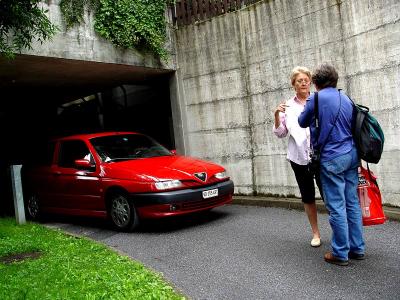 Carlos pulling out of the underground parking garage and Karen and Milchen Chatting