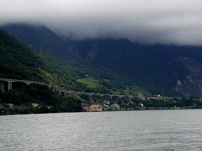 Chateau Chillon can be seen in the distance across Lake Geneva.