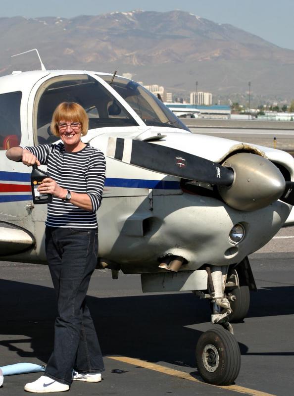 Sue adding oil