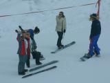 Learning to strap into the board, not as easily as it looks.  Almost guaranteed to fall over everytime.