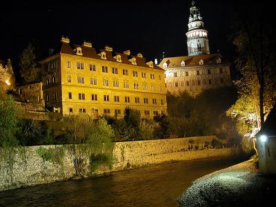 castle, tower and Vltava river at night