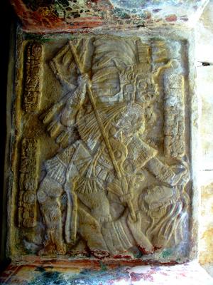 Original doorway carving where warrior hold enemy by hair and is speared