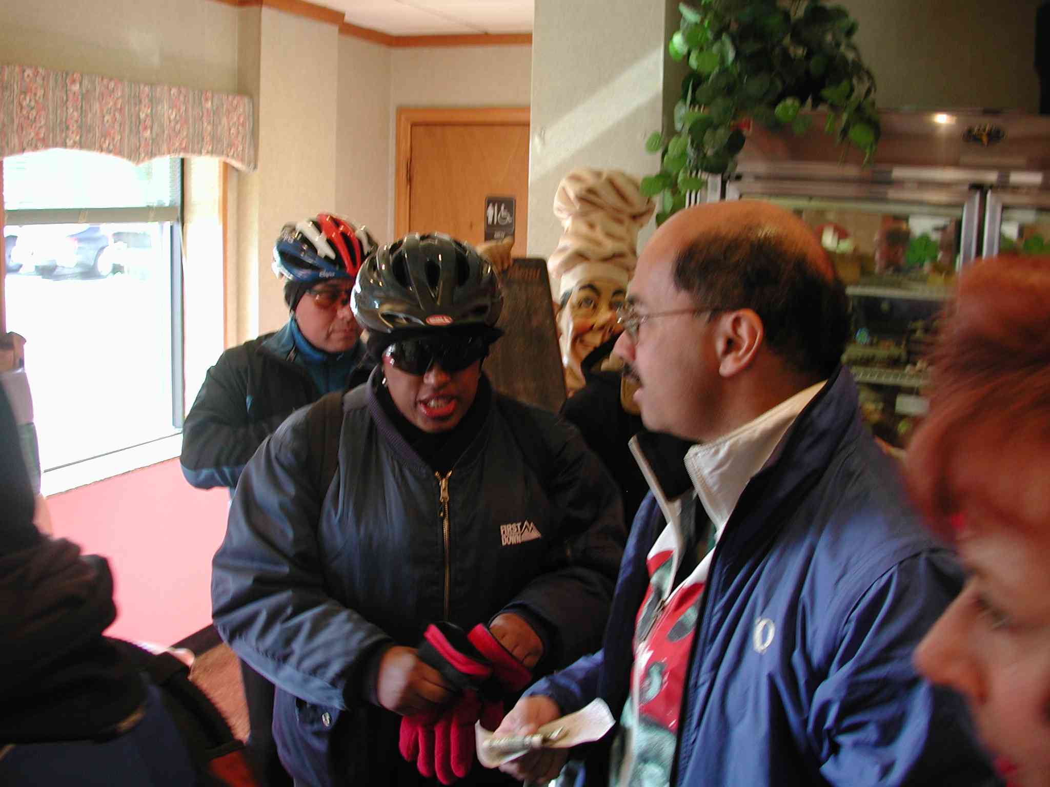 Alfredo Garcia (blue jacket) settling up with the cashier after our pancake brunch