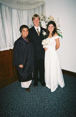 The Justice of the Peace stands with the Bride and Groom