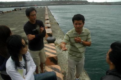 At Keelung port discussing ideas