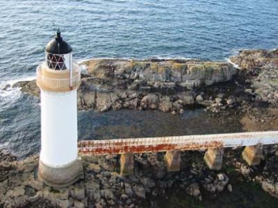 Lighthouse beneath bridge.JPG