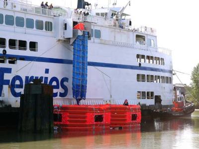 Chutes release from rafts, outer rafts towed away