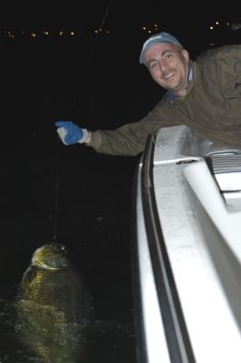 mike-with-70lb-tarpon-04-16-04.jpg