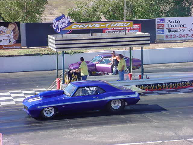blue drag racer <br> getting ready to launch