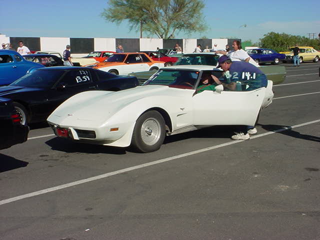 white Corvette <br>getting ready to race