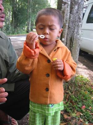 child blowing bubbles at the lookout at Lake Batur