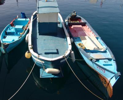 Three blue boats