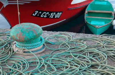 Green ropes and red boat