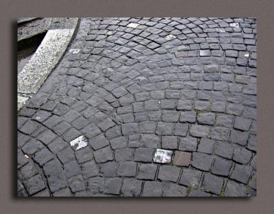 Rain On Patterned Pavement at Grossmunster Kirche