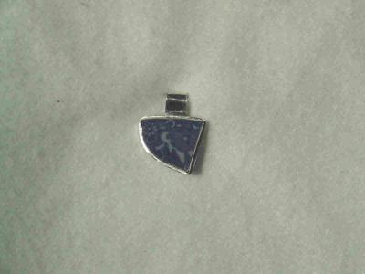 This pendant is made with a porcelain shard found on my sister's property. not for sale.