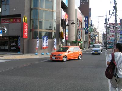 Orange Mazda 2 Narita 2004