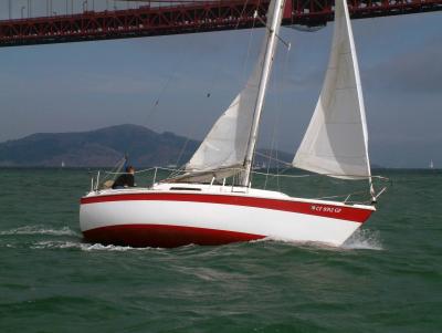 sailing in front of the bridge