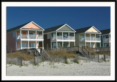Some of the many beautiful seaside homes along the beach in Surfside Beach, South Carolina, just south of Myrtle Beach.