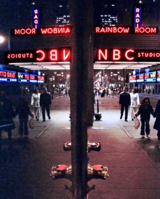 Rainbow room reflected in window