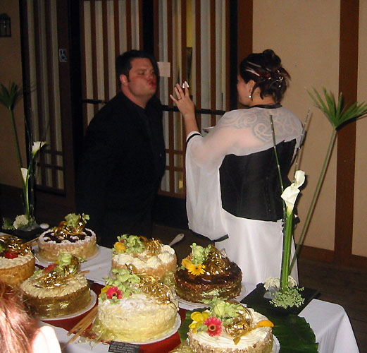 Aiming the wedding cake