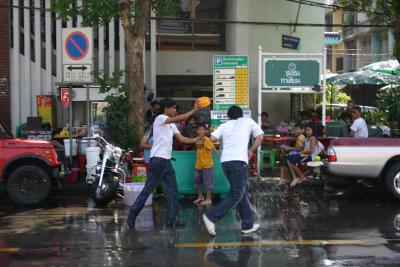 Thai New Years!! No one is excempt from Water and rice flower