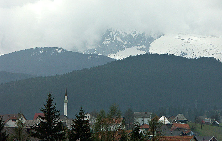 Minaret and snowy peaks near Rozaje