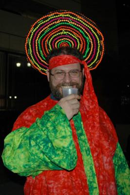 The Toga Krewe attends the Bacchus Parade