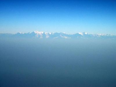 Nepal Himalayas rise above the haze of India