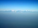 Nepal Himalayas rise above the haze of India