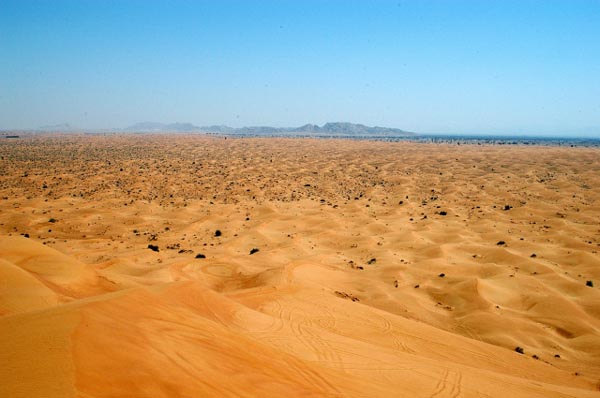 View towards the mountains over the sandy desert