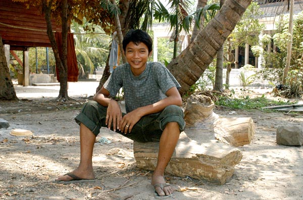 Cambodian boy at the village inside the moat of Angkor Wat