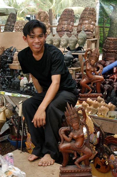 Vendor of wood carvings at Angkor Wat