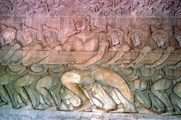 Deva holding the tail of a serpent (East face)