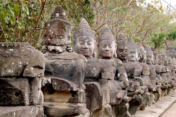 A line of 54 gods lining the left side of the southern causeway to Angkor Thom