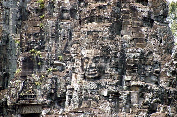 Up close, carved faces cover the Bayon Temple