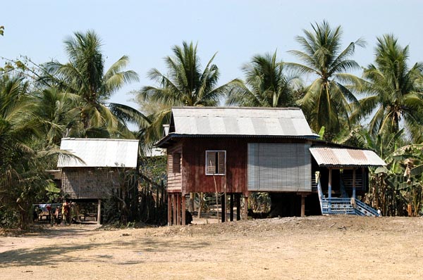 An uncommon tin roofed hut along the road near Ta Phrom