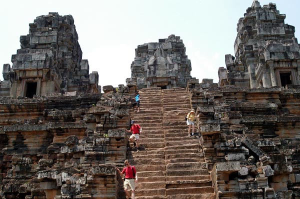 Steep sandstone steps lead to the top of the temple, the tower of which is 50m tall