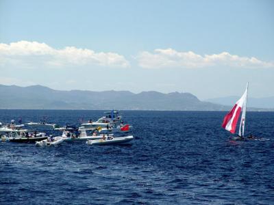 Austria finishes first, and is approached by Media boats (Tornado Race 11)