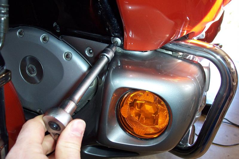 Remove the allen screw on the upper portion of the lower cowl, both sides