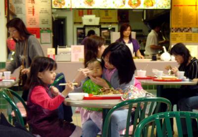 The food courts are packed with serious diners of all ages.  This baby already knew to open her mouth like a little bird.