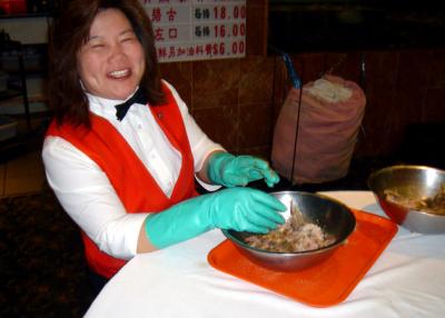 Our Magic Wok waitress Yvonne had to do double duty shredding salted fish for the next day's meals