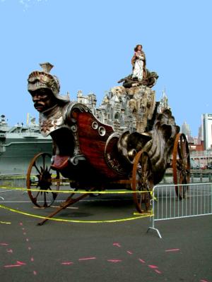 ...beside the Greenway, on the pier south of the Intrepid.  

From Palermo came the most massive presentation of the parade -- the grand Carro Trionfale, or Carriage of Triumph, which celebrates Santa Rosalia, the patron saint of Palermo. Made entirely of wood, iron, and silver, the carriage is nearly 36 feet long, 26 feet tall, over 16 feet wide, and weighs in at nearly 11,000 pounds. The carriage is more sculptural art than float in showing the city of Palermo, the mountains it abuts, and a hand-carved sculpture of Santa Rosalia, who saved the city from the black plague in 1624. The carro, which has been used in Palermo's Festino di Santa Rosalia for the past four years, is a gift from the City of Palermo to the Columbus Citizens Foundation. It was pulled up Fifth Avenue by oxen.