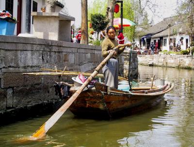 Vendor rowing her boat