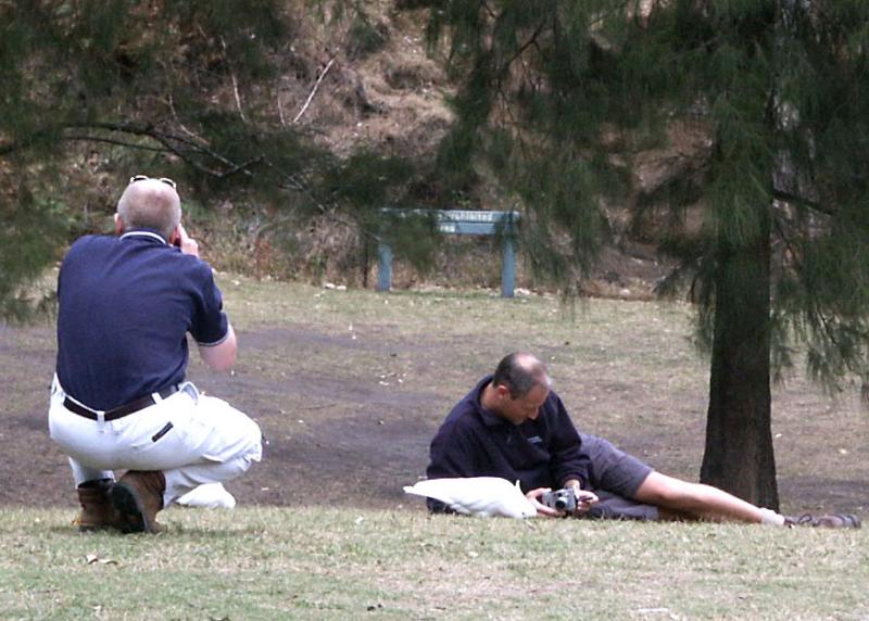 Im photographing man on left photographing man on right photographing a cockatoo