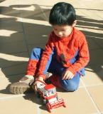 Small boy, small toy