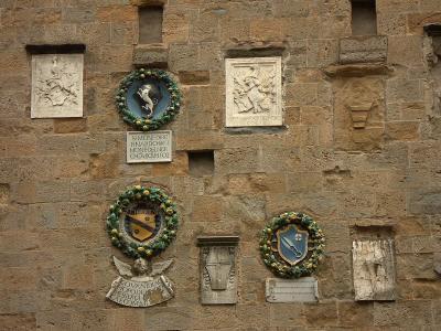 Emblems on Palazzo del Priori, Volterra