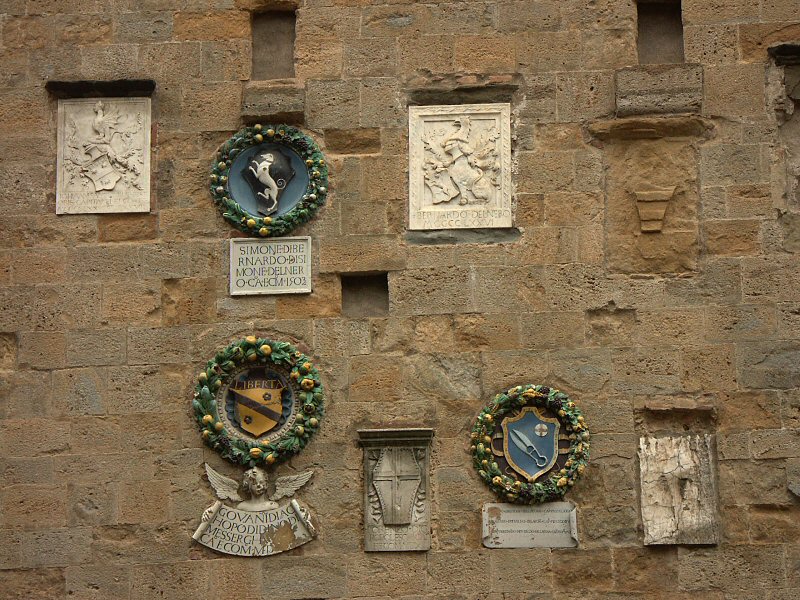 Emblems on Palazzo del Priori, Volterra