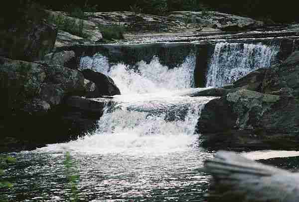 A portion of the 'upper falls' section of Linville Falls - near Linville, North Carolina.  

From my 'birthday trip' to the mountains, with my 'midlife crisis' camera (the Maxxum 7).

Over 100 shots of Linville Falls, done with 3 Minolta cameras and about 10 different lenses, can be viewed on my personal site at http://clemmie.smugmug.com .