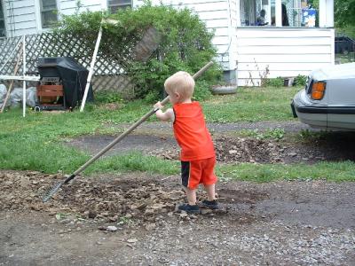 Helping rake the driveway